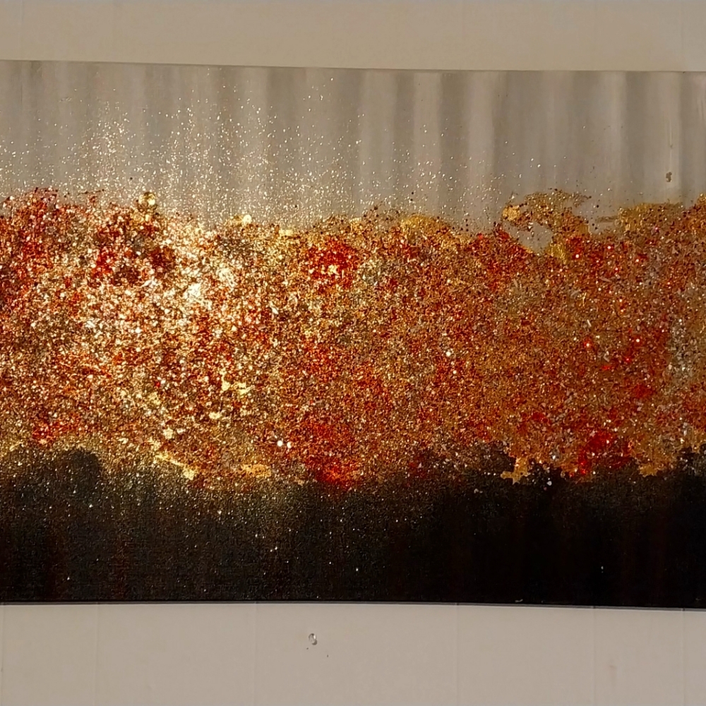 This is a triptych made of acrylic, crushed glass, and goldleaf.